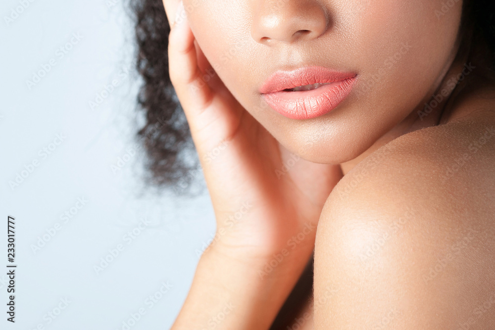 Young beautiful black girl with clean perfect skin close-up