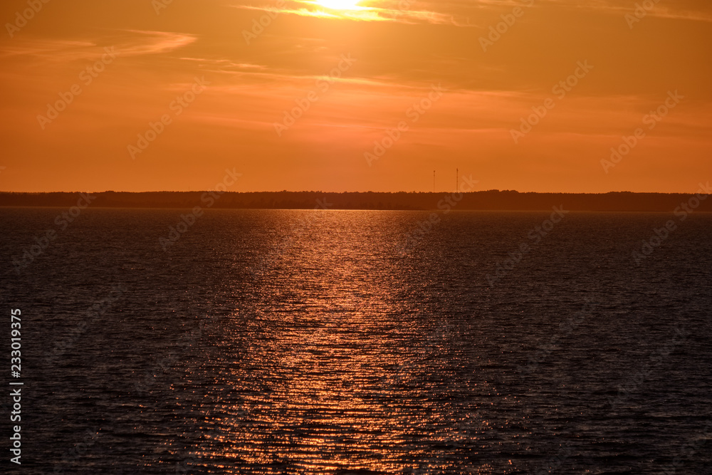 red saturated colors in sunset over the sea