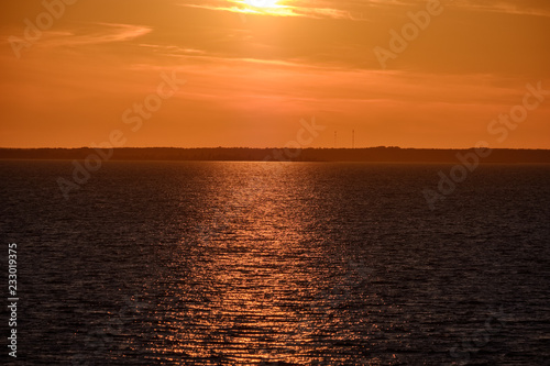 red saturated colors in sunset over the sea
