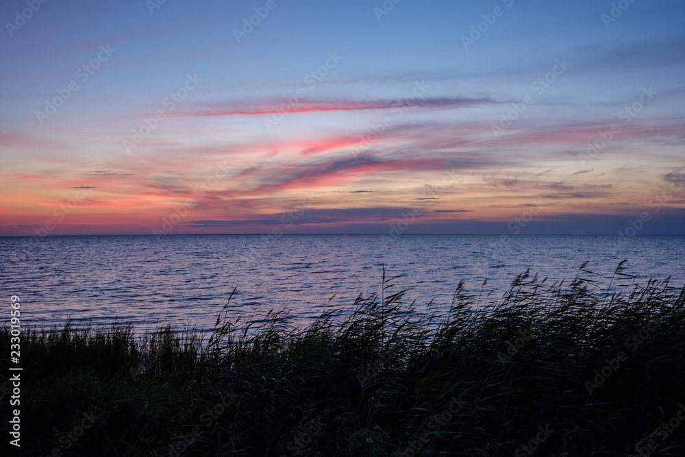 red saturated colors in sunset over the sea
