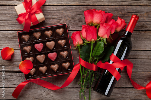 Red roses, wine bottle and chocolate box