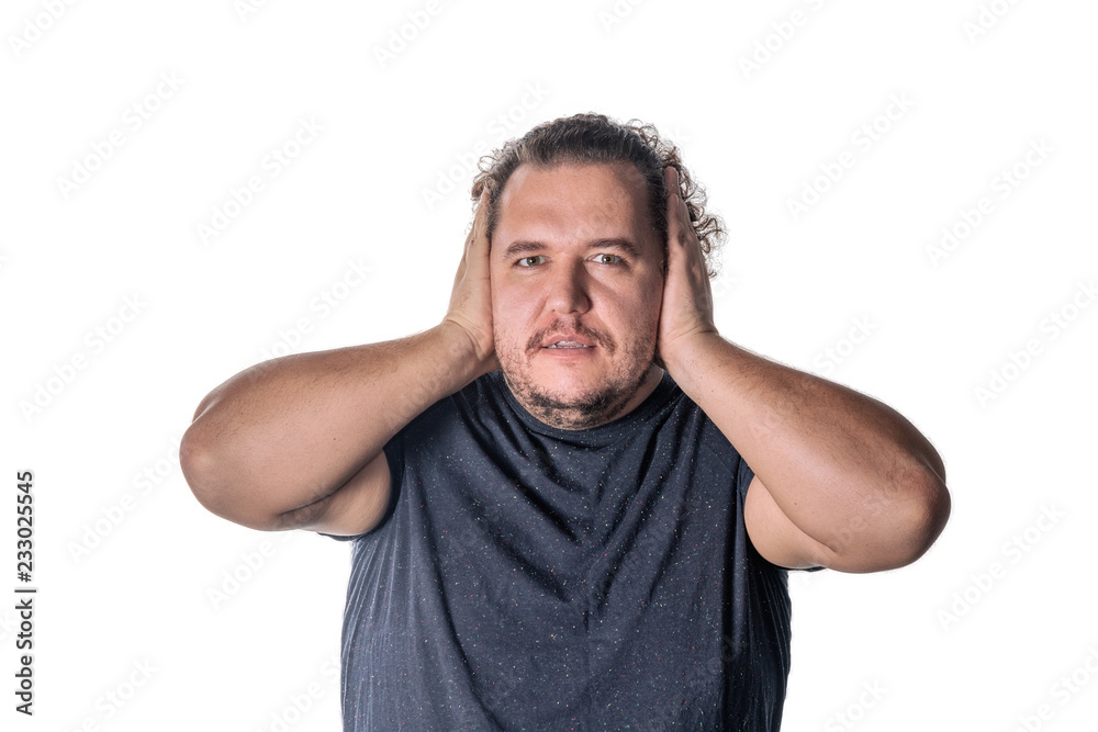 Man covering his ears witn hands, closing his eyes, isolated on white background. Hear no evil concept. Emotions facial expressions and communication signs Man covering his ears witn hands, closing his eyes, isolated on white background. Hear no evil concept. Emotions facial expressions and communication signs