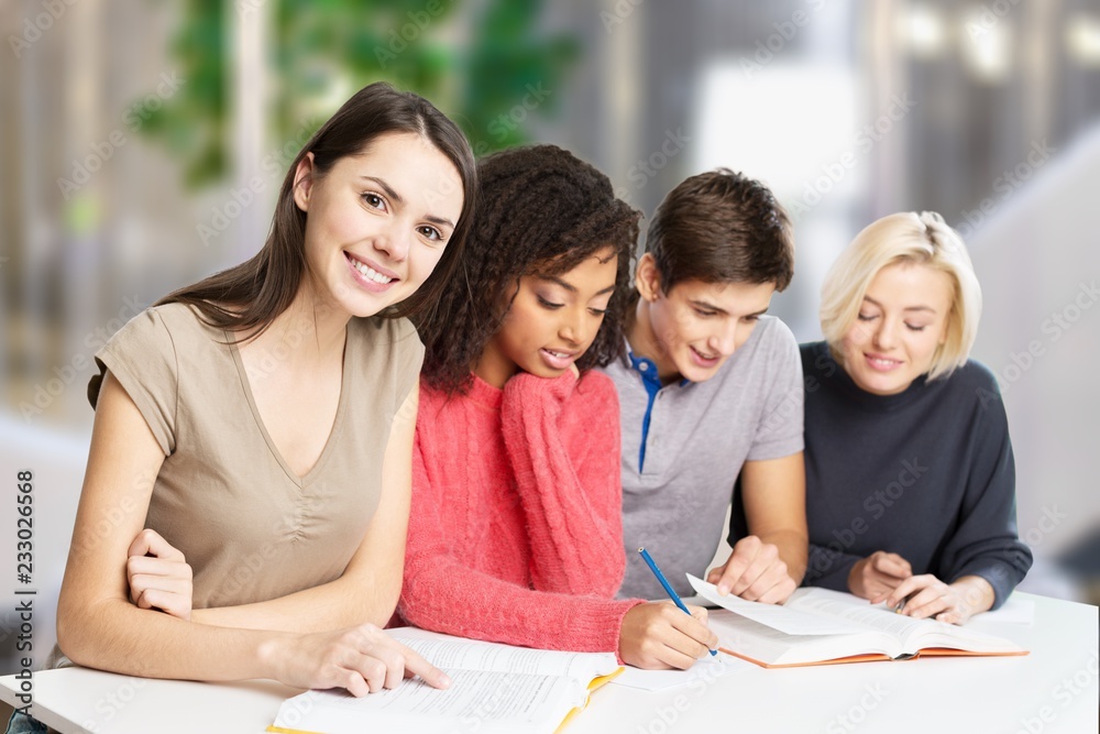 Group of students with books on background Group of students with books on background