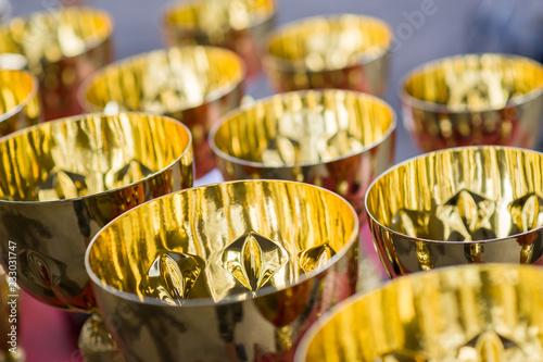 Golden cups on the table  close up