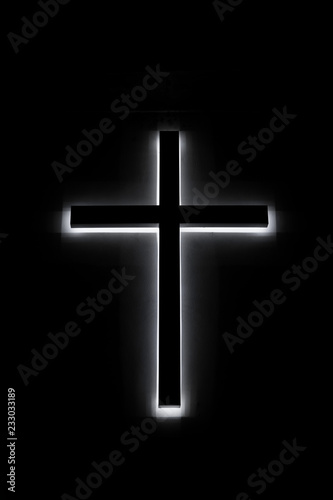 A led glowing church cross light in night