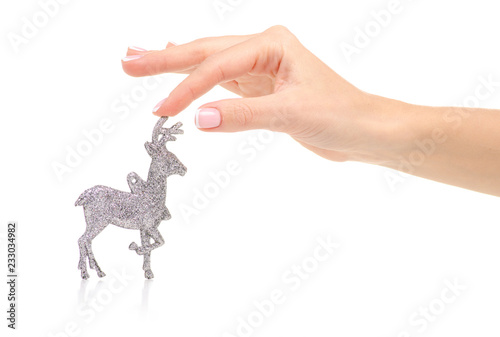 Christmas toy silver deer in hand on a white background. Isolation