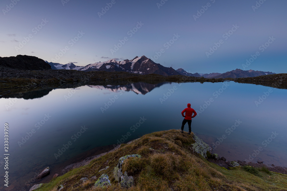 hiker in the mountain at sunrise