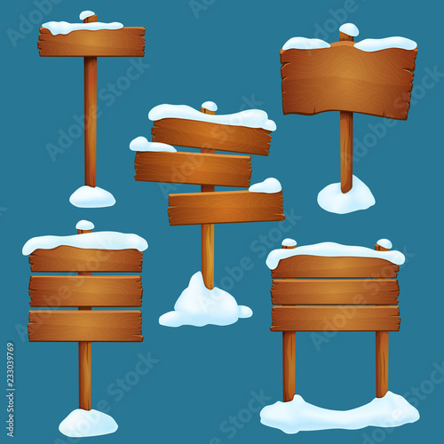 Set of snow covered old wooden signposts with differently arranged planks isolated on a blue background. Winter, late autumn element.
