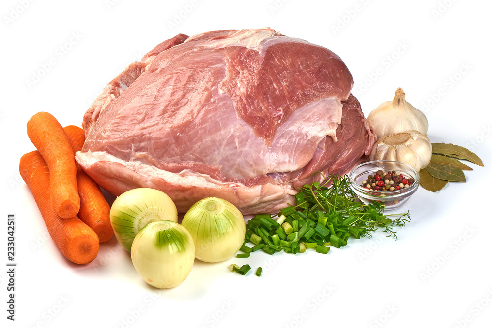 Uncooked ham or gammon with vegetables on a cutting board, isolated on a white background. Close-up. Uncooked ham or gammon with vegetables on a cutting board, isolated on a white background. Close-up.