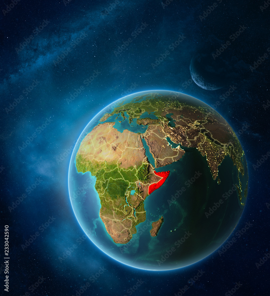 Planet Earth with highlighted Somalia in space with Moon and Milky Way. Visible city lights and country borders.