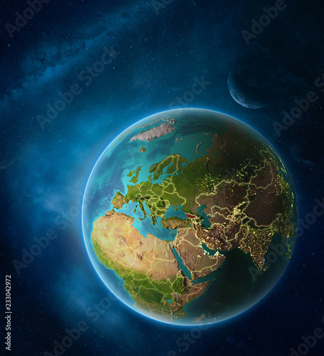 Fototapeta Naklejka Na Ścianę i Meble -  Planet Earth with highlighted Georgia in space with Moon and Milky Way. Visible city lights and country borders.