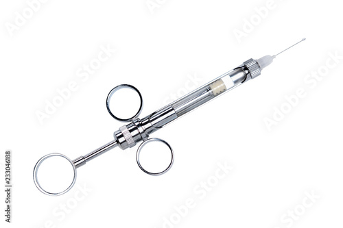 Carpool syringe for anesthesia in dentistry. Close-up top view isolated on white background.