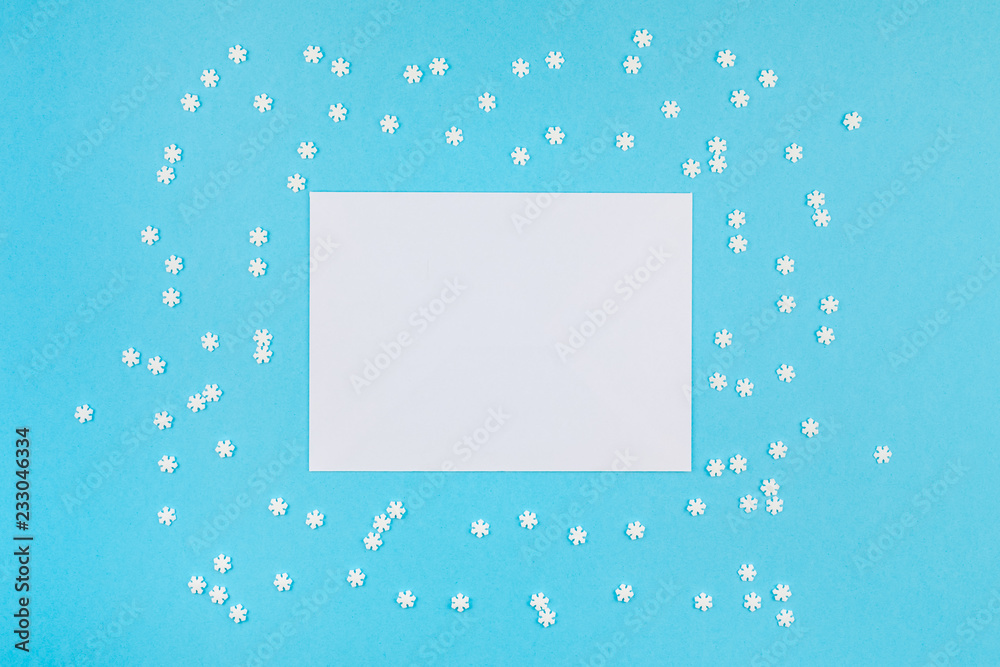 Winter pattern made of small white snowflakes Winter pattern made of small white snowflakes