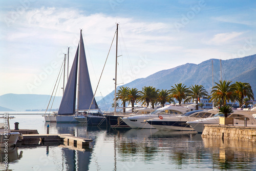 Beautiful nautical landscape with luxury yachts and mountains
