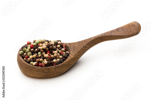 Pepper mix seed on spoon on white background.