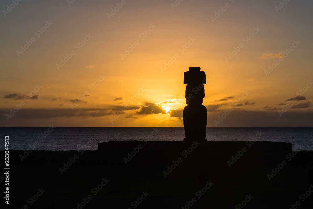 Moia silhouette in Easter Island during the sunset