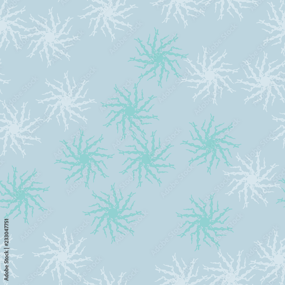 Winter seamless pattern with chaotic snowflakes in different shades of blue color