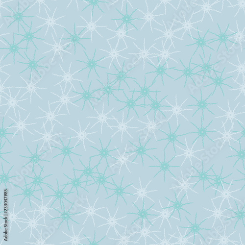 Winter seamless pattern with chaotic snowflakes in different shades of blue color