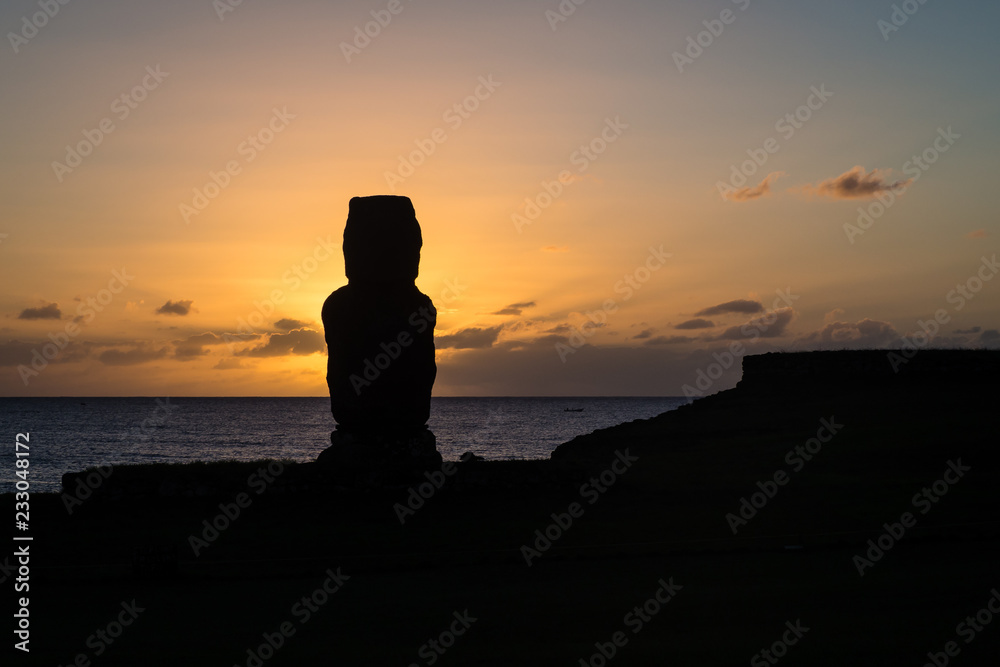Moia silhouette in Easter Island during the sunset