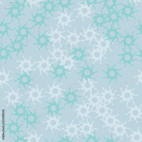 Winter seamless pattern with chaotic snowflakes in different shades of blue color