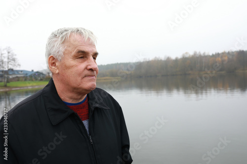 Man on bank of Zaslavsky reservoir © Arkady Chubykin