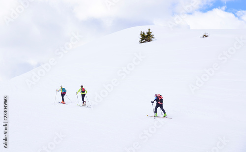 hikers on the alps on a sunny winter day