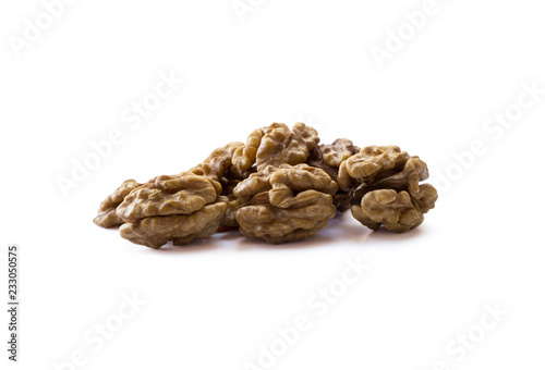 Kernels walnuts isolated on white background. Heap of walnuts isolated on white background. Top view. Walnuts on white background. Walnuts with copy space for text.