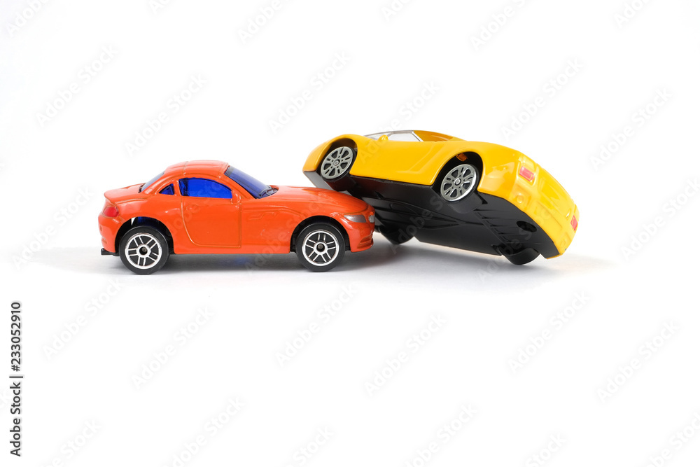 Car accident concept. Yellow and red toy cars on a white background