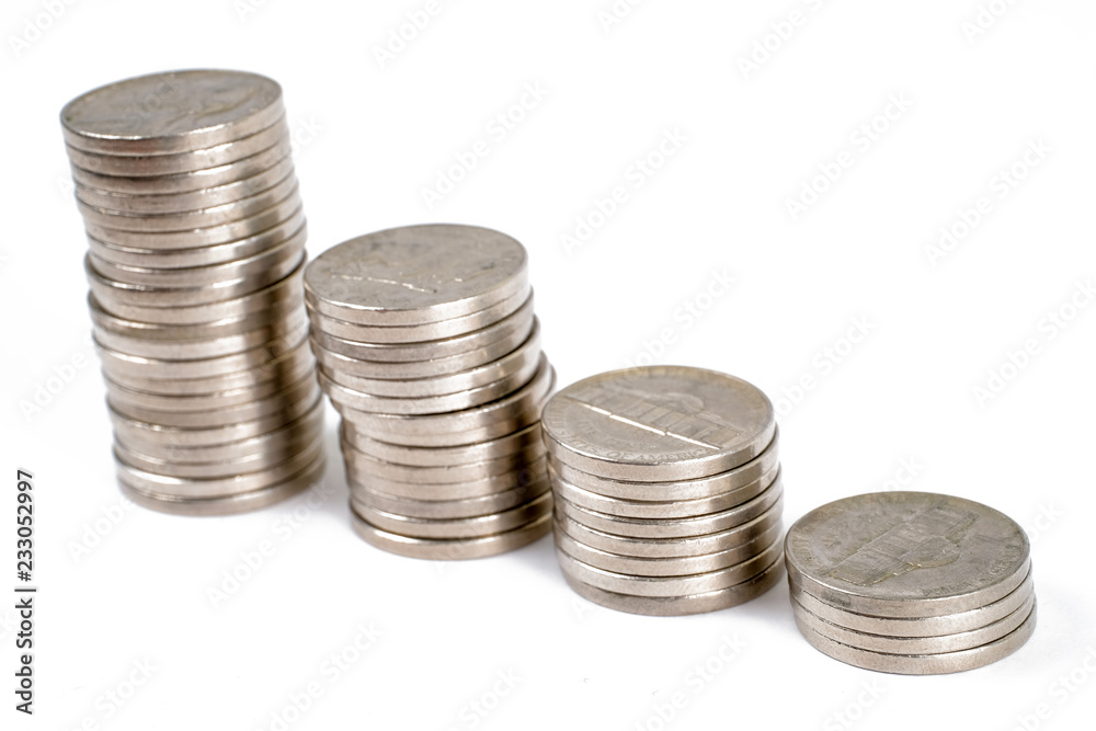 The concept of growth savings. Stacks of coins ascending on a white background. The concept of growth savings. Stacks of coins ascending on a white background.