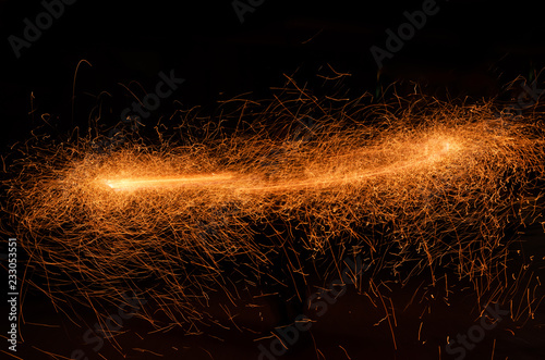 Fototapeta Firestorm from particles of sparks of fire