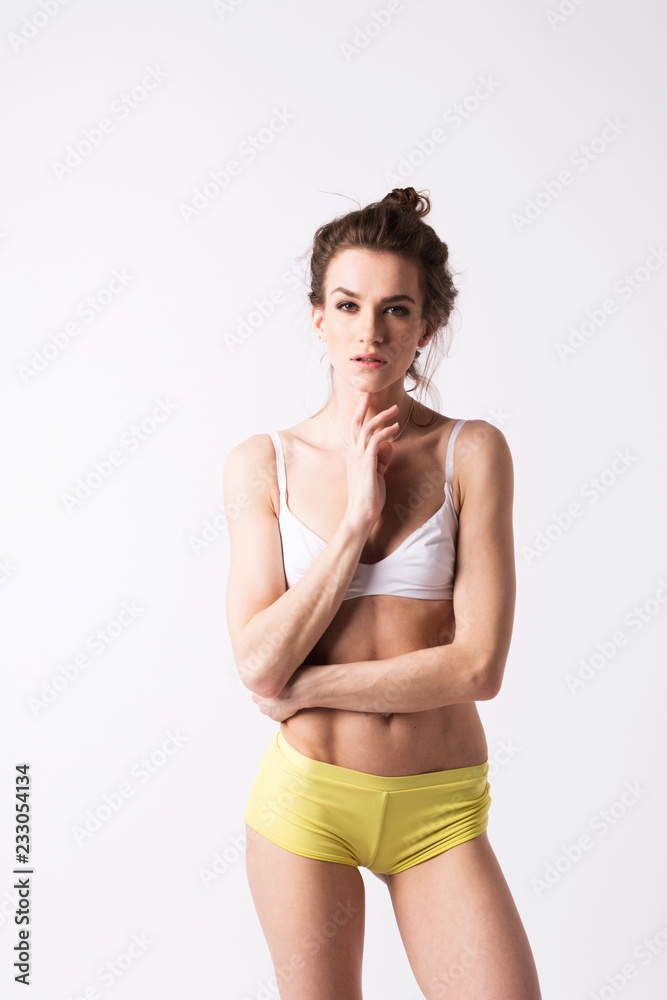 Naklejka premium Slim woman's body on white background.