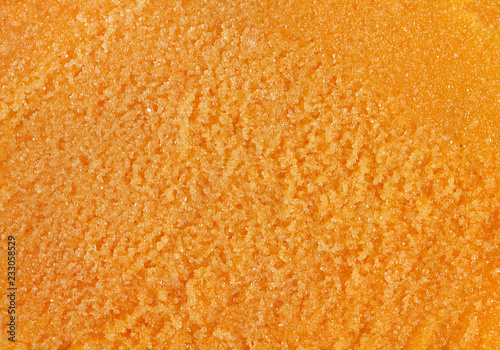 Orange creamy texture. Thick citrus paste. Top view.