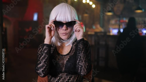 Sexy unusual blonde girl with eyewear in a bar