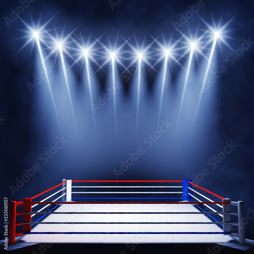 Boxing ring lit by spotlights, Fight night event
