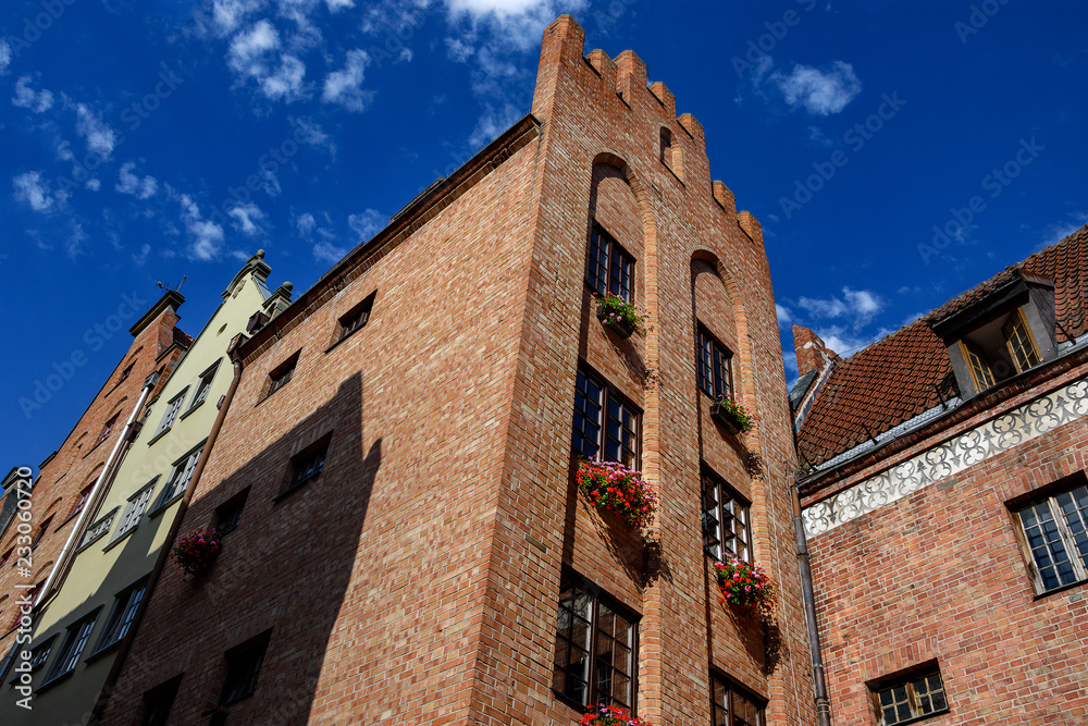 Building architecture close up on famous Swietego Ducha street in Main Town of Gdansk, Poland