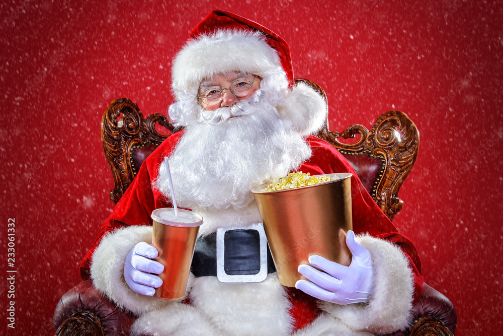 Fototapeta premium santa claus is watching a movie