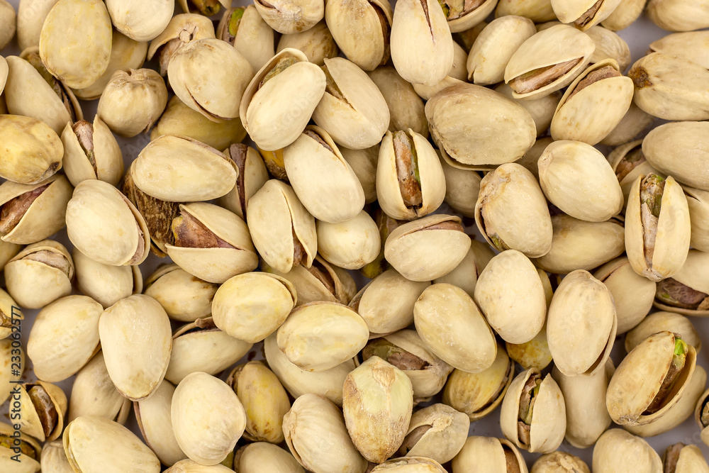 Nuts pistachios are not cleaned. Background, texture. Nuts pistachios are not cleaned. Background, texture.