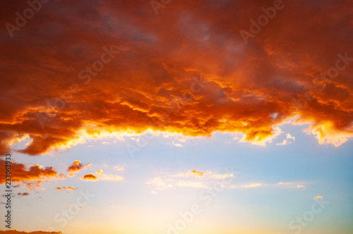 Clouds in a red colored sunset in the Colorado Desert Plateau at the Tuba City  United States. It is the spectacle of nature - the first hints of rose that creep into the sky and turn into a blaze