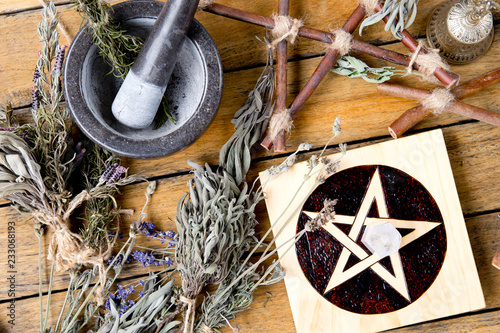 Herb Witch workings with Mortar and Pestle, pentacle altar tile with dried herb bundles, and brass bell