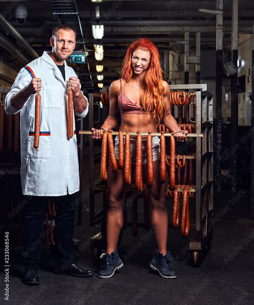 Funny butcher and his sexy girl assistant in the storage room. Stock Photo  | Adobe Stock