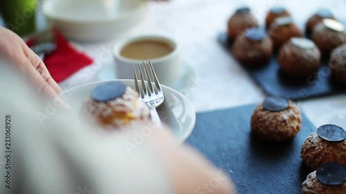 Close up hand man with cup of coffee with sweets or candy chocolates bar obsession candy delicious cocoa dark dessert food milk black brown yummy appetizing beverages bonbon cappuccino