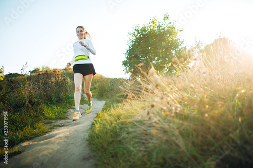 Image of running athlete woman in park