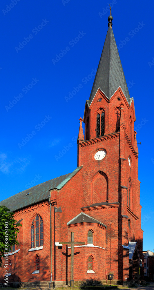 Ustka, Pomerania, Poland - Neo-gothic church of Holiest Saviour in Ustka at the Baltic Sea shoreline