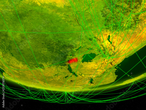 Rwanda on green model of planet Earth with network representing digital age, travel and communication. photo