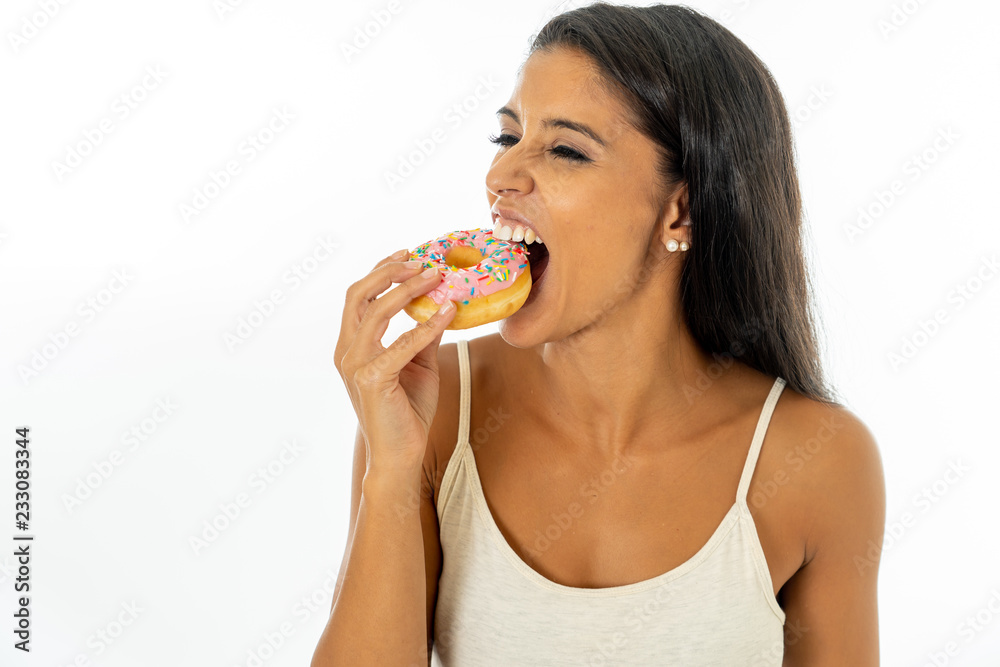 Portrait of attractive pretty girl eating tasty donuts isolated over white background Portrait of attractive pretty girl eating tasty donuts isolated over white background
