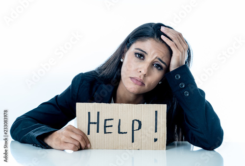 Beautiful young business woman overwhelmed and tired holding a help sign © SB Arts Media