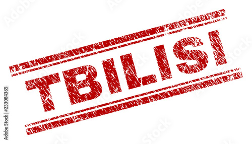 TBILISI seal print with corroded texture. Red vector rubber print of TBILISI text with grunge texture. Text label is placed between double parallel lines.