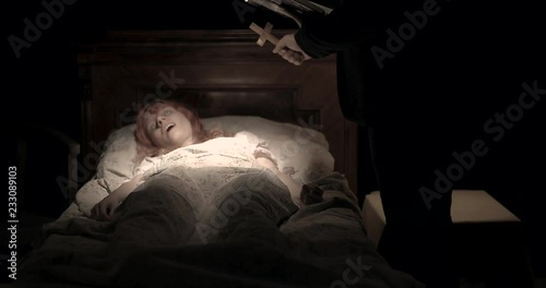 the priest with the cross do an exorcism the obsessed girl