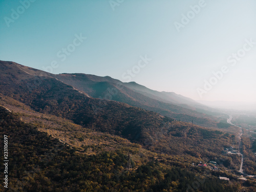 Mountain nature landscape panorama, view from above, rocks in morning sunlight © DedMityay
