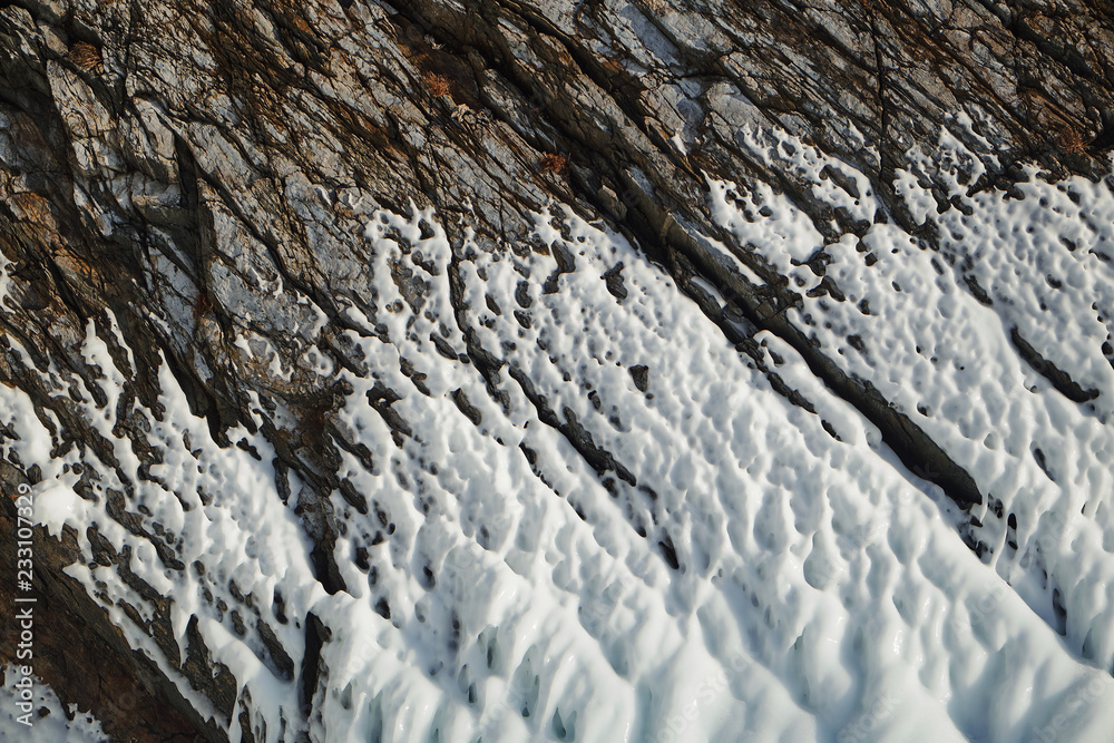 Icу on the rocks. Lake Baikal is a frosty winter day. Icу on the rocks. Lake Baikal is a frosty winter day.
